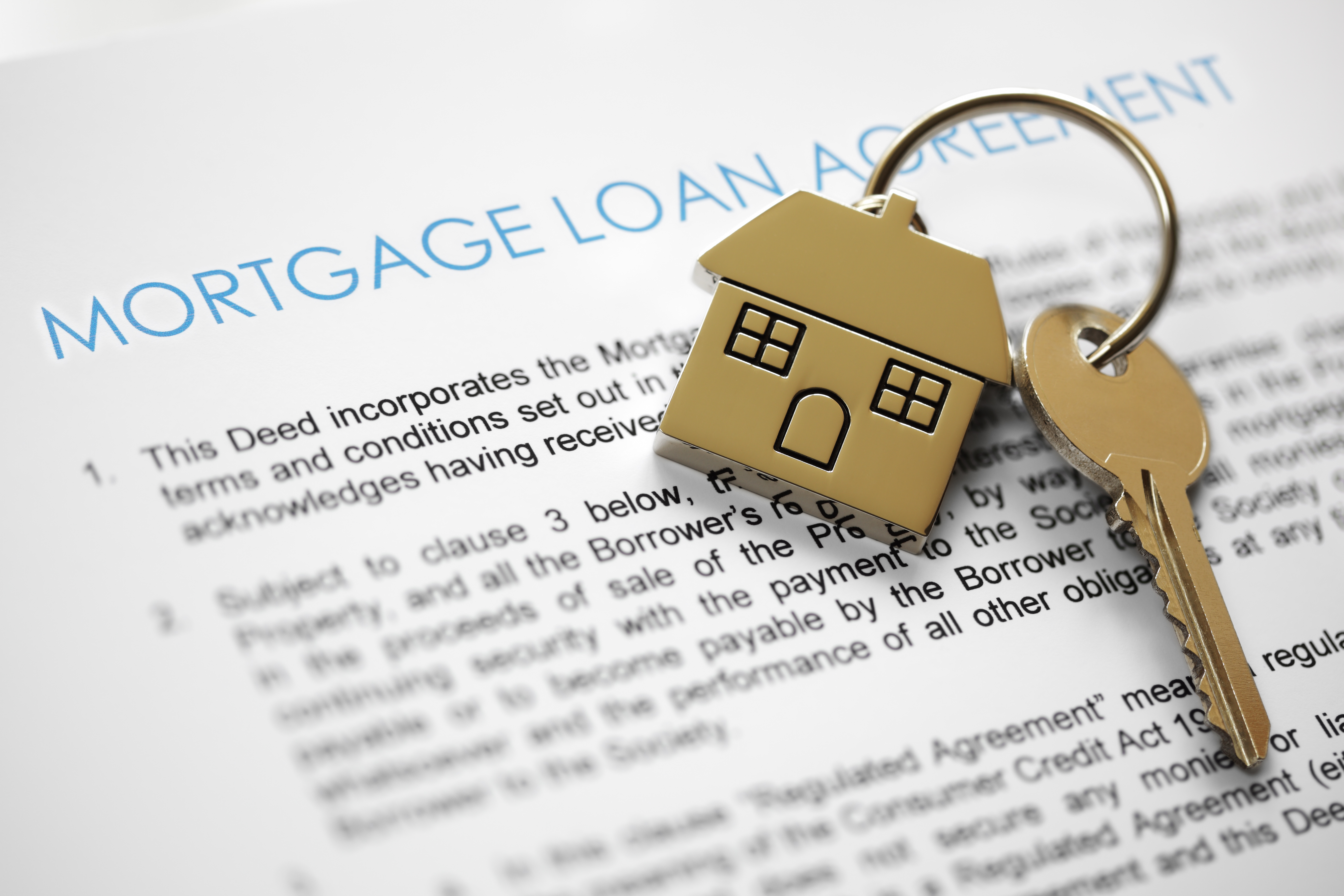 House keys over mortgage loan document