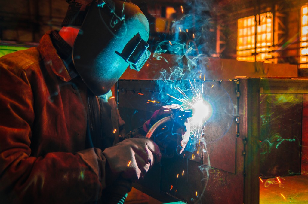 a man working using his welding equipment