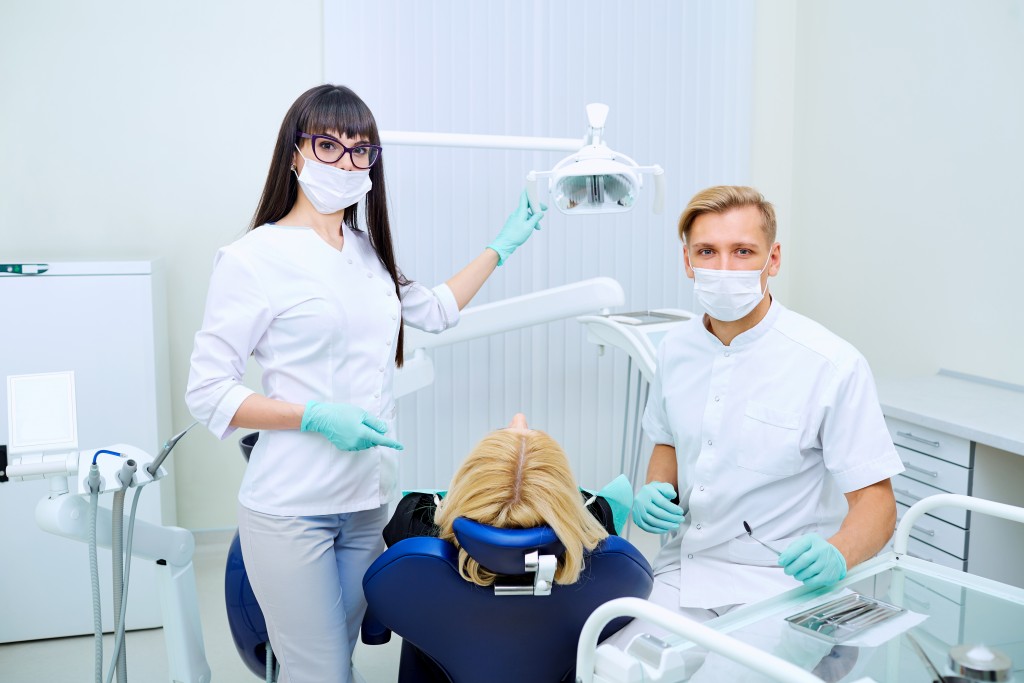 Dental clinic with patient and dentist