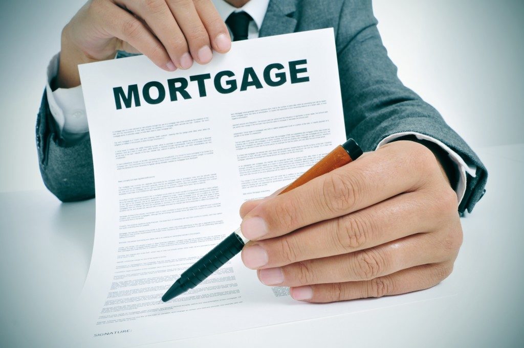 Man showing mortgage contract