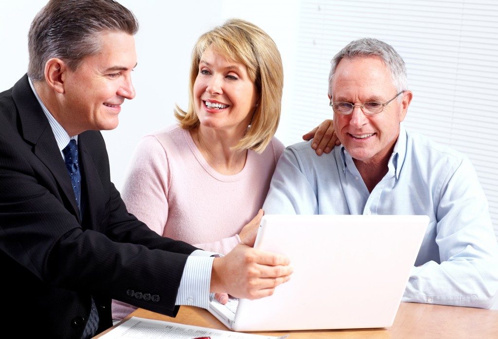 Financial advisor talking to middle-aged clients