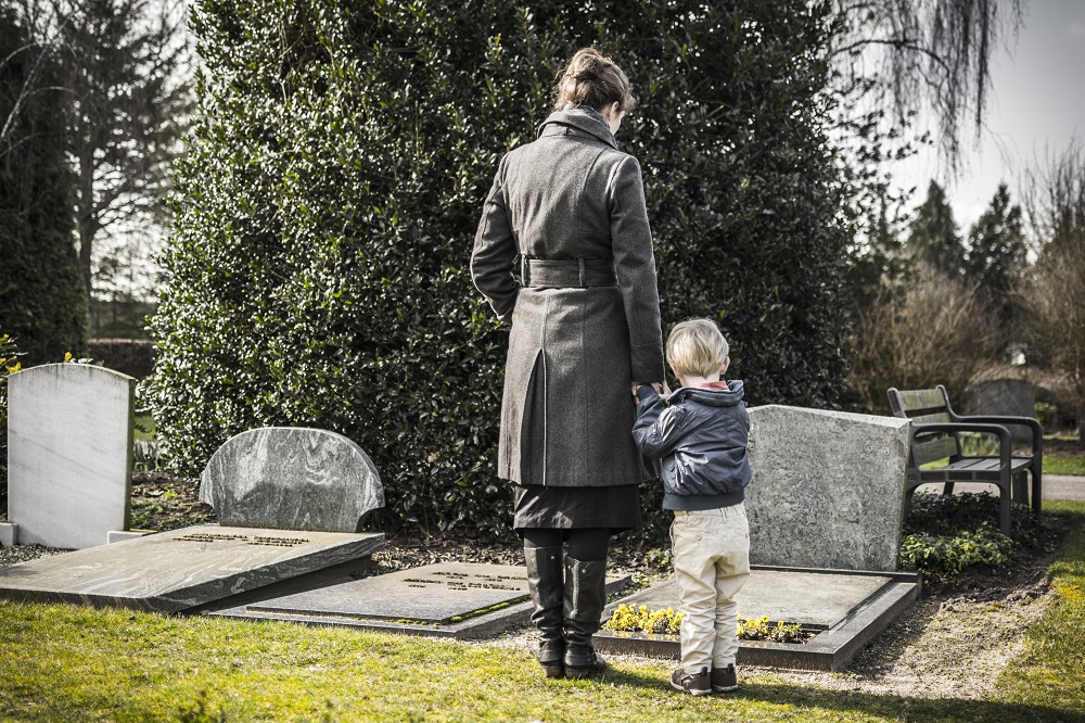 woman and child in graveyard