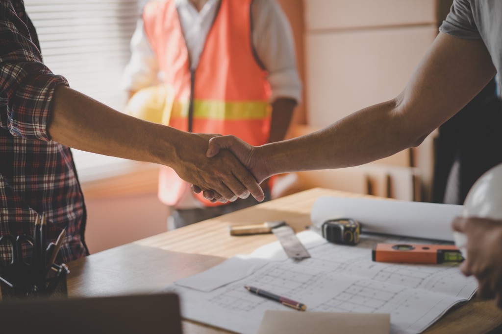 Contractor and client handshake